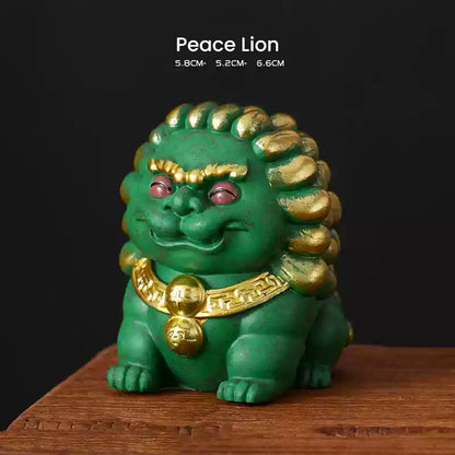 A green Peace Lion ornament with golden accents, symbolizing protection and harmony, displayed on a wooden surface with its dimensions listed above.