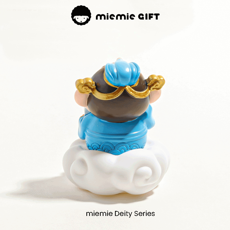 Chinese God of Literature Miniature: A cute Wenquxing figurine, the deity of literature and the arts, adorned with a blue and gold outfit, standing on a fluffy white cloud base