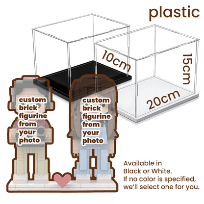 Plastic display cases for custom brick figurines, available in black or white base options, with dimensions 20cm x 10cm x 15cm. Perfect for preserving and showcasing personalized creations