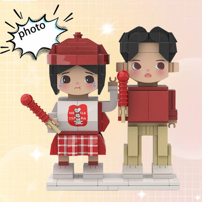 Custom brick figurines of a couple in red-themed outfits, showcasing emotional expressions and detailed accessories for a personalized touch.