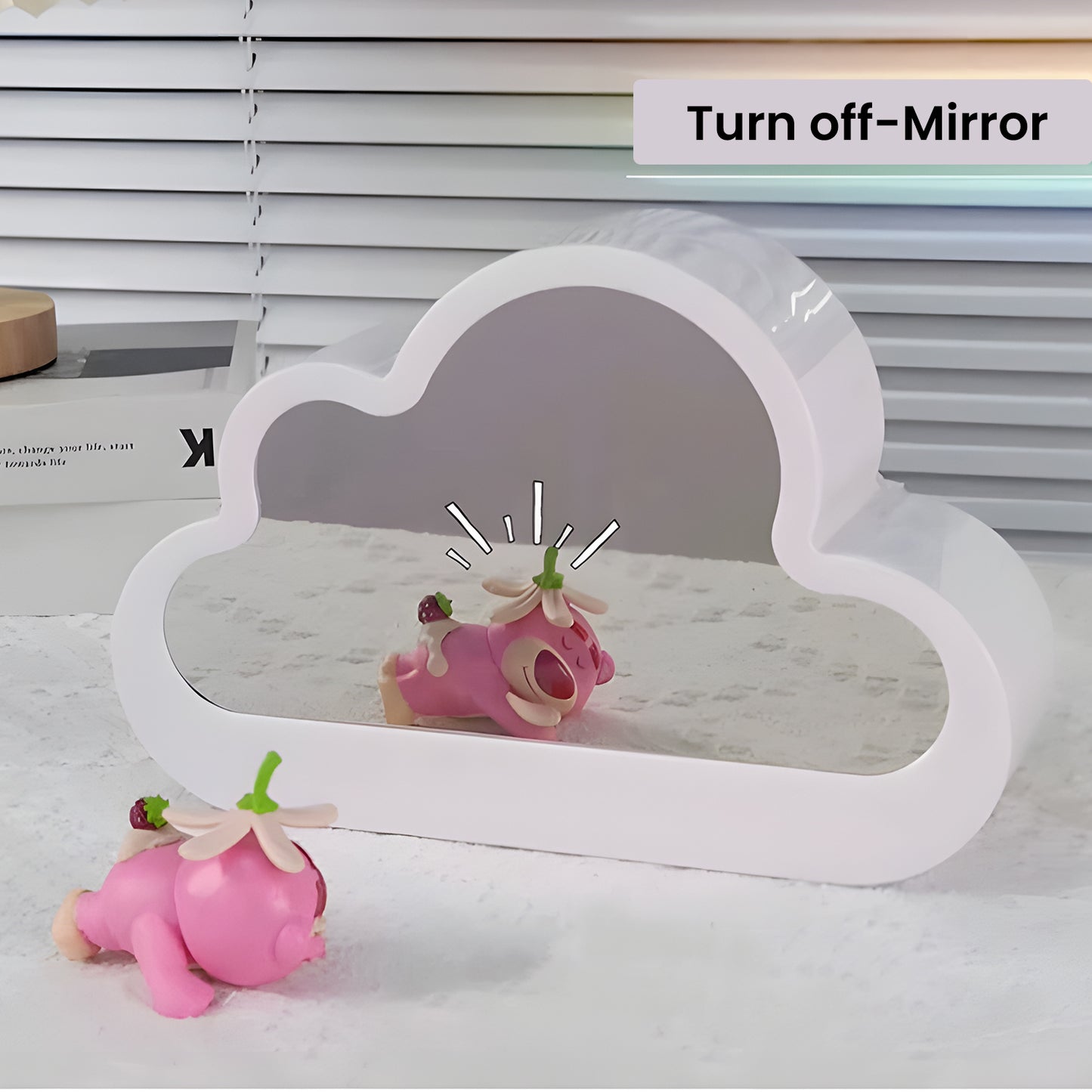 A DIY cloud-shaped nightlight turned off, showcasing its clear mirror function, with a playful toy reflection on the surface.