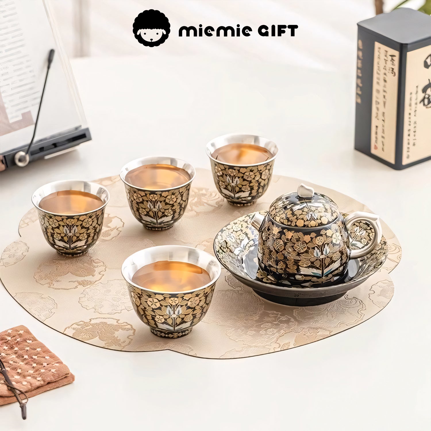 Golden Branches & Jade Leaves Gilded Silver Tea Set fully arranged on a table with four cups, a teapot, and matching tray, showcasing its intricate details and luxurious design, perfect for tea ceremonies or gifting