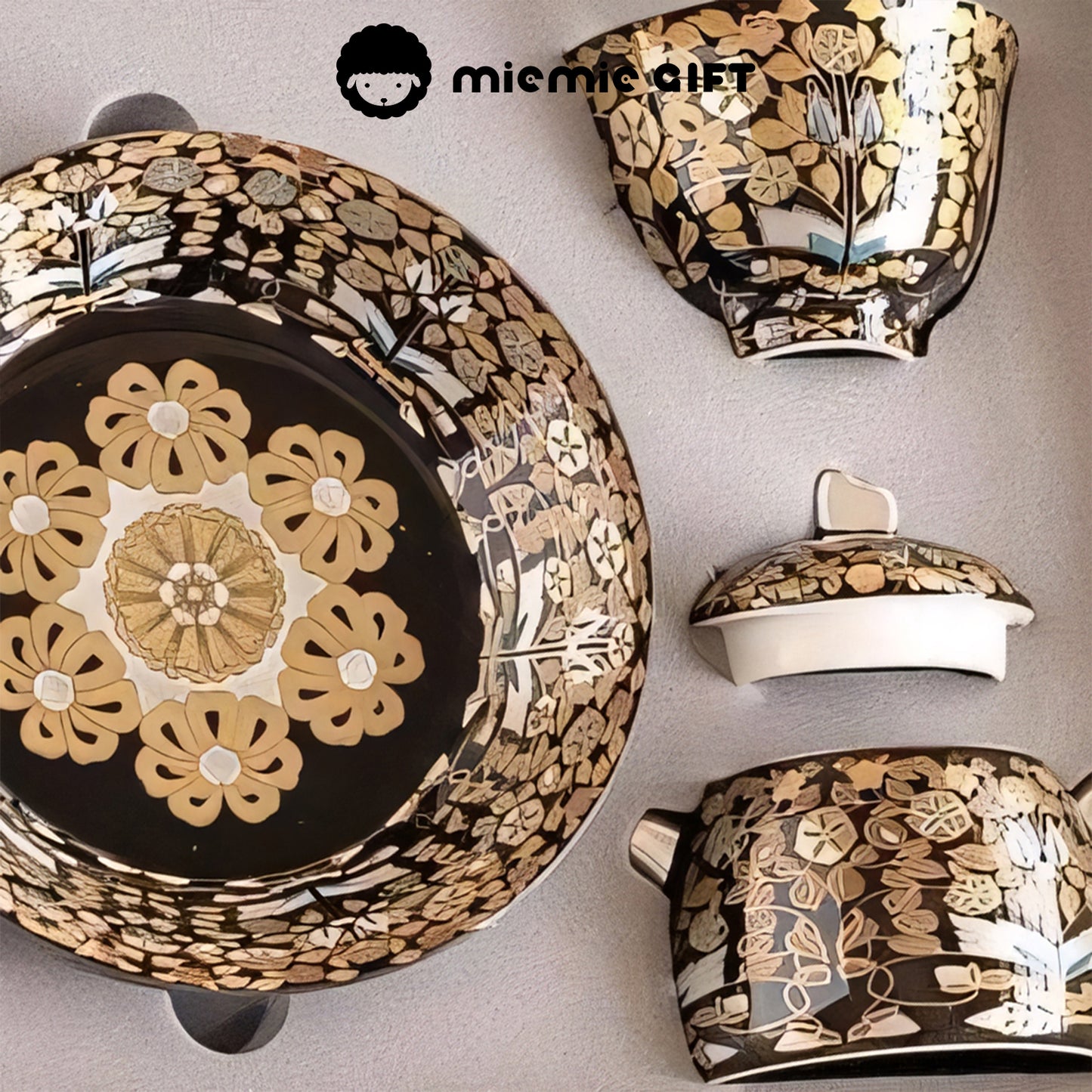 Close-up view of the components of the Golden Branches & Jade Leaves Gilded Silver Tea Set, including the tray, teacup, teapot, and lid, showcasing intricate floral patterns and craftsmanship