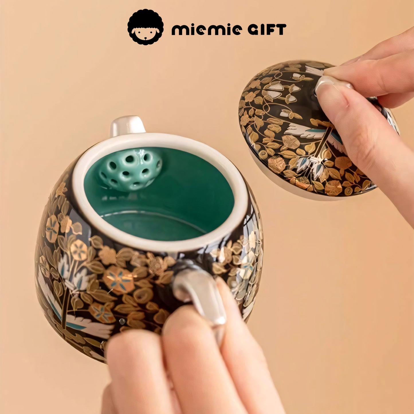 Interior view of the Golden Branches & Jade Leaves Gilded Silver Teapot, featuring a built-in filter and intricate floral design on the lid and exterior, showcasing its functional and artistic details.