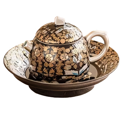 Golden Branches & Jade Leaves Gilded Silver Teapot elegantly placed on a matching tray, showcasing intricate gold floral patterns and exceptional craftsmanship in a luxurious design.