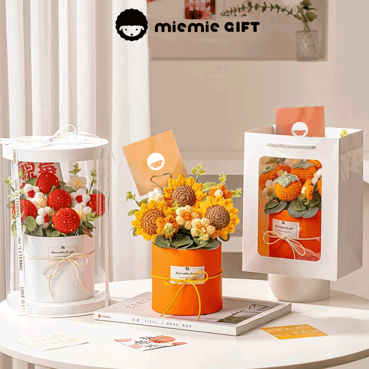 Crochet Bouquet of hand-knitted strawberries sunflower and Persimmon Flowers a delightful gift for any occasion, showcased in a white bag with a rope handle and a motivational tag