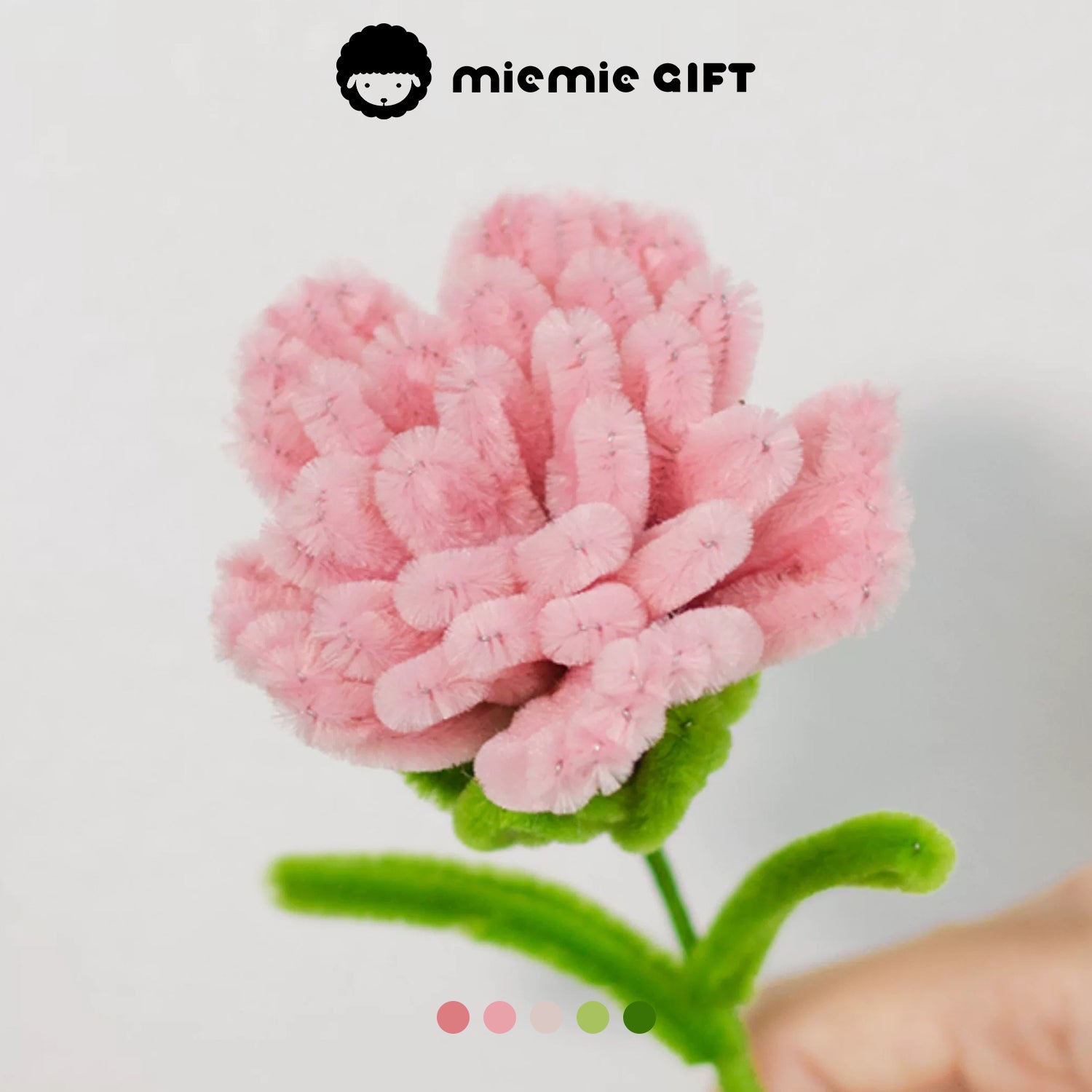 Handmade pink carnation flower created with pipe cleaners by MieMie Gift, showcasing intricate details and vibrant colors for DIY floral designs.