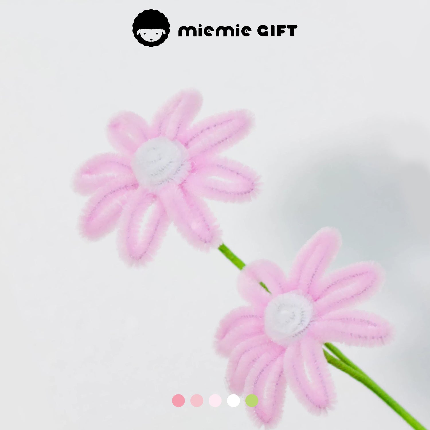 Close-up of pink handmade daisy flowers with white centers, crafted with pipe cleaners by MieMie Gift for DIY projects and gifting.