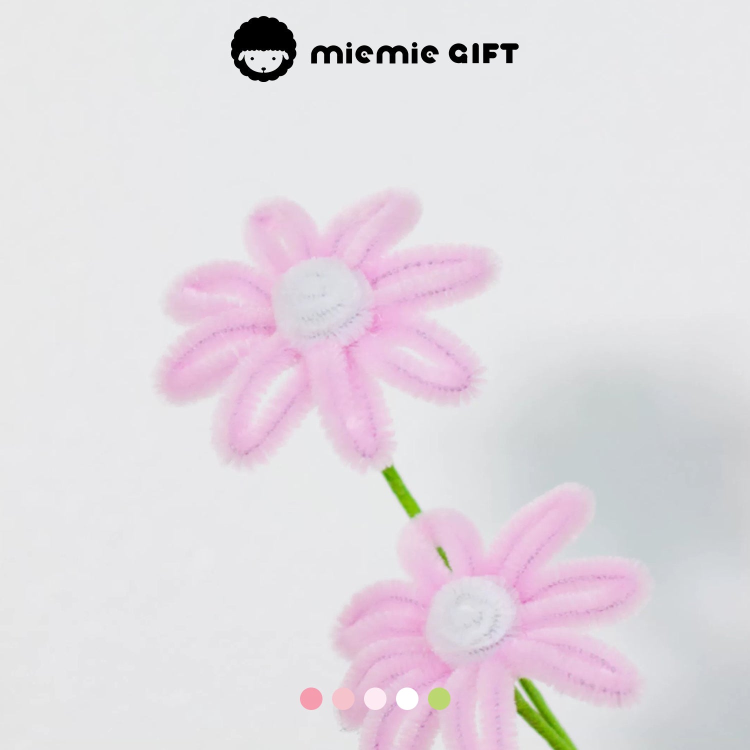 Delicate pink handmade daisy flowers with white centers, created with pipe cleaners by MieMie Gift, ideal for creative crafts and floral arrangements.