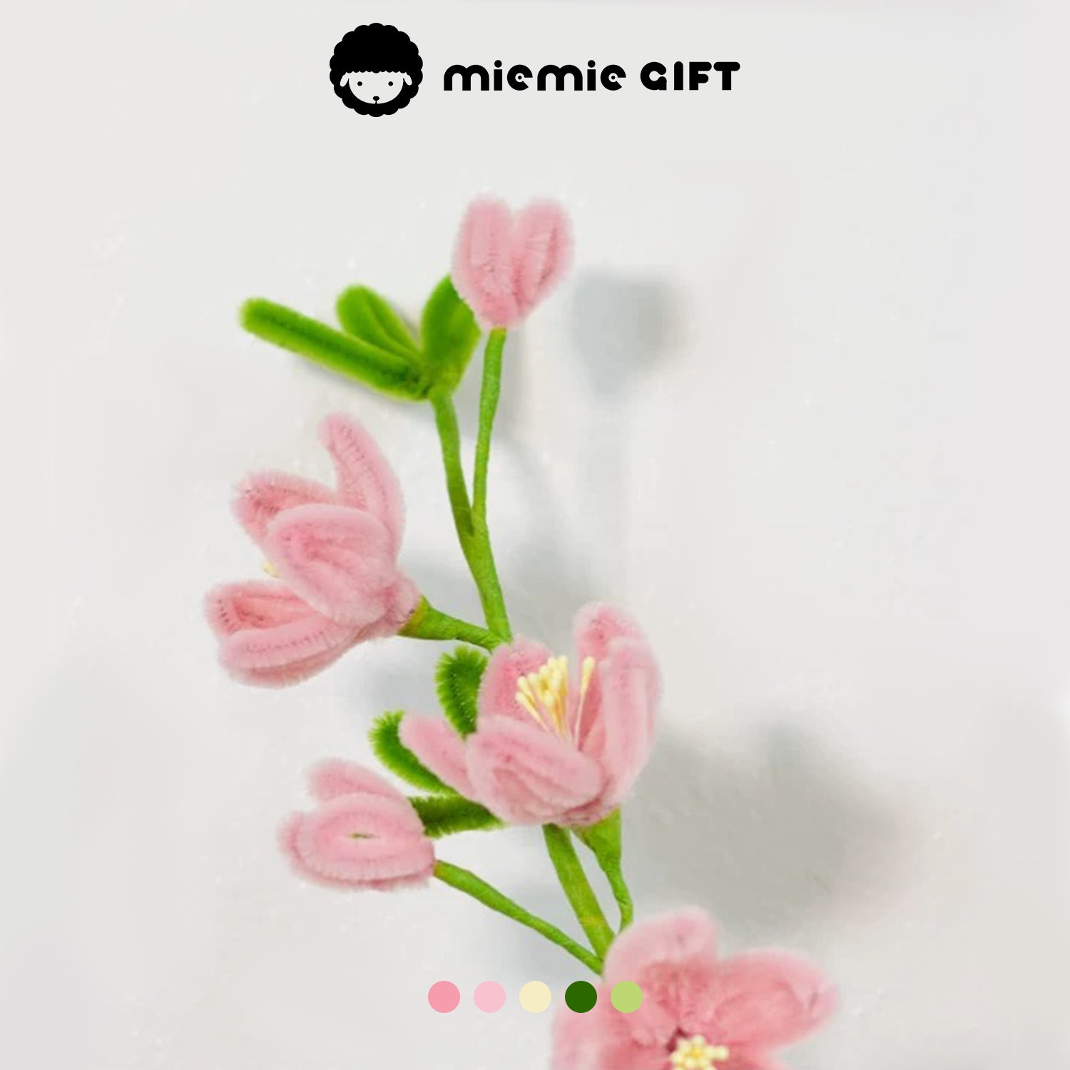 Delicate pink peach blossom branch made with pipe cleaners by MieMie Gift, ideal for adding a touch of elegance to handmade flower crafts.