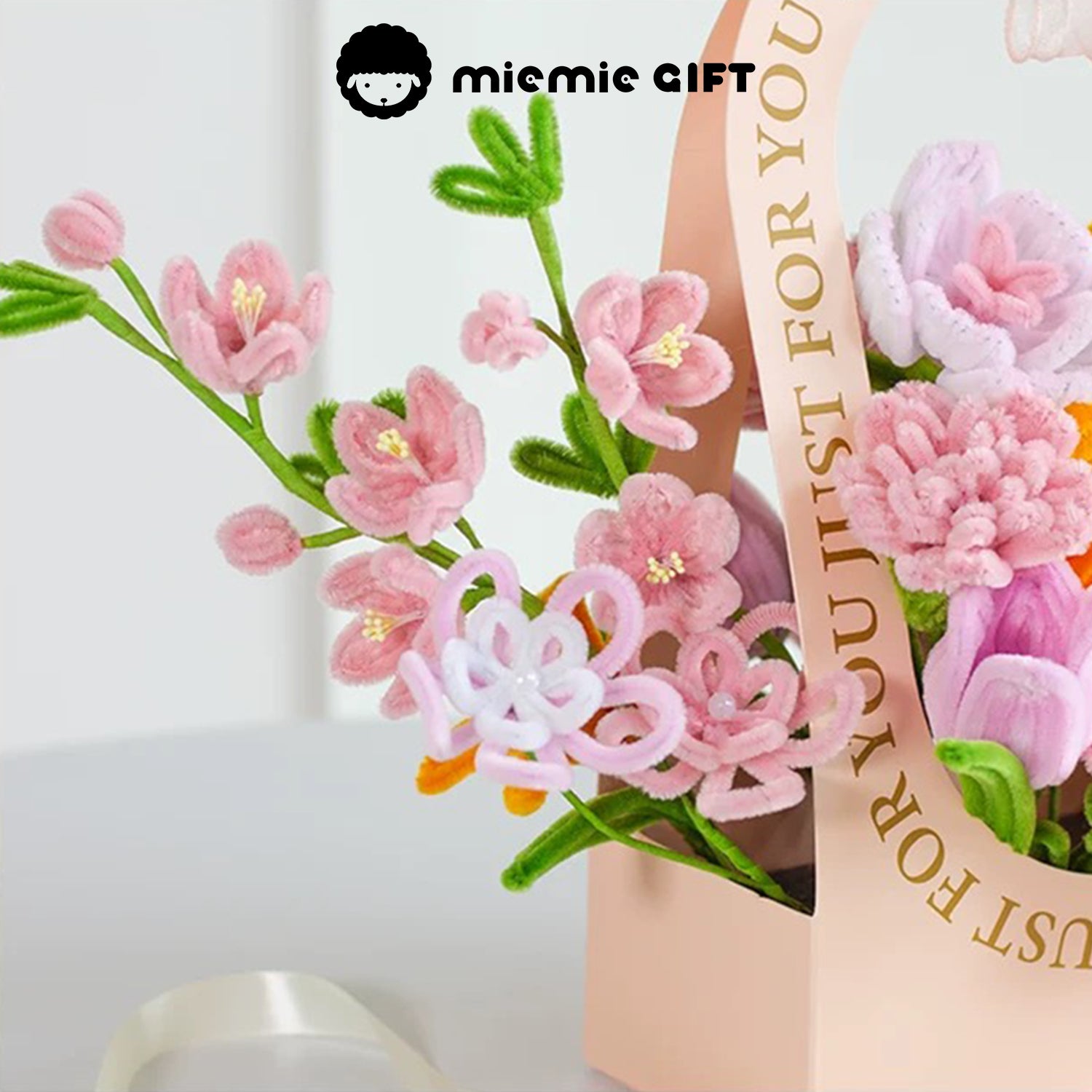 Close-up of MieMie Gift DIY Flower Basket highlighting delicate pink handmade pipe cleaner flowers, perfect for creative crafting projects.