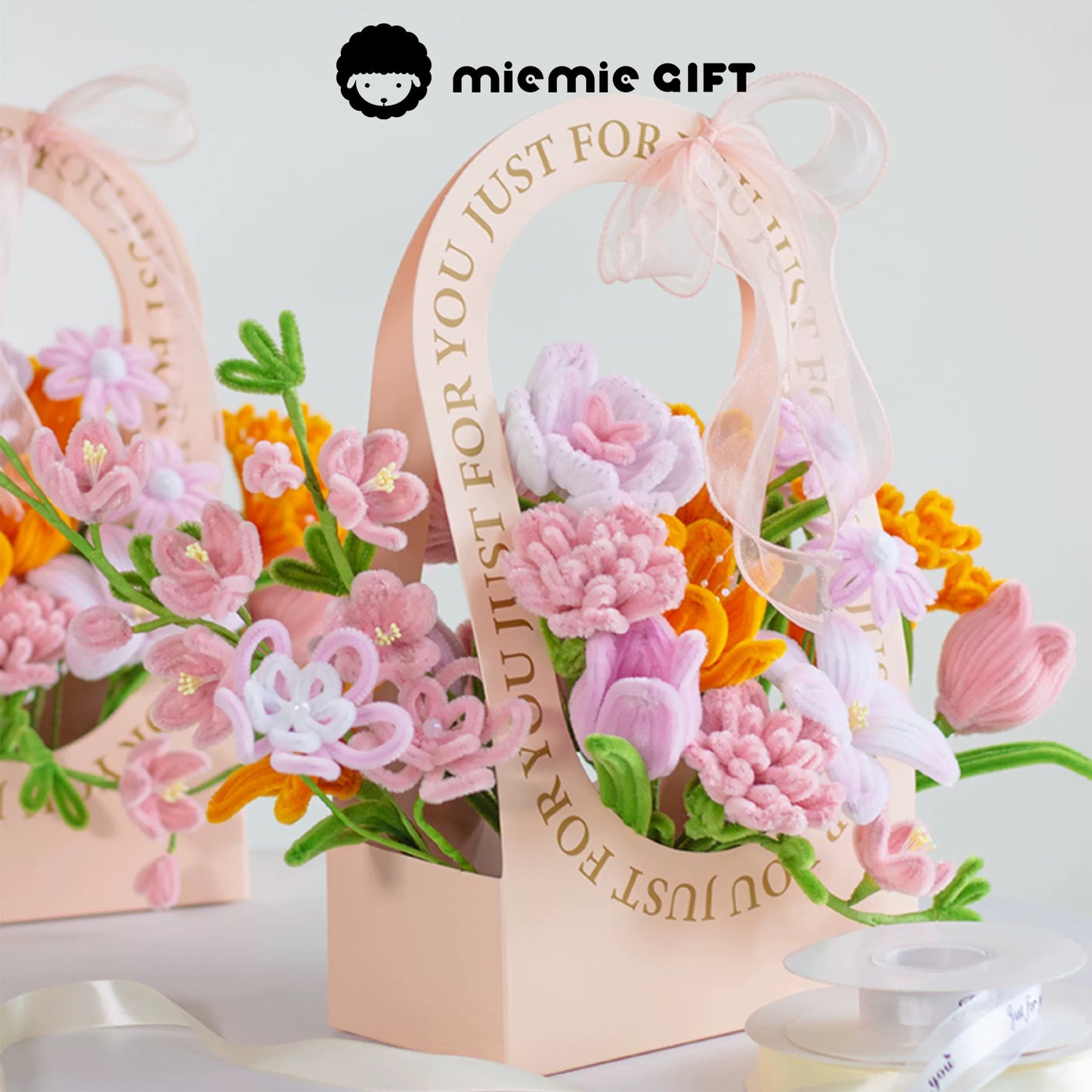 DIY Flower Basket by MieMie Gift with handmade pipe cleaner flowers in soft pink, orange, and white tones, creating a charming and elegant floral arrangement.