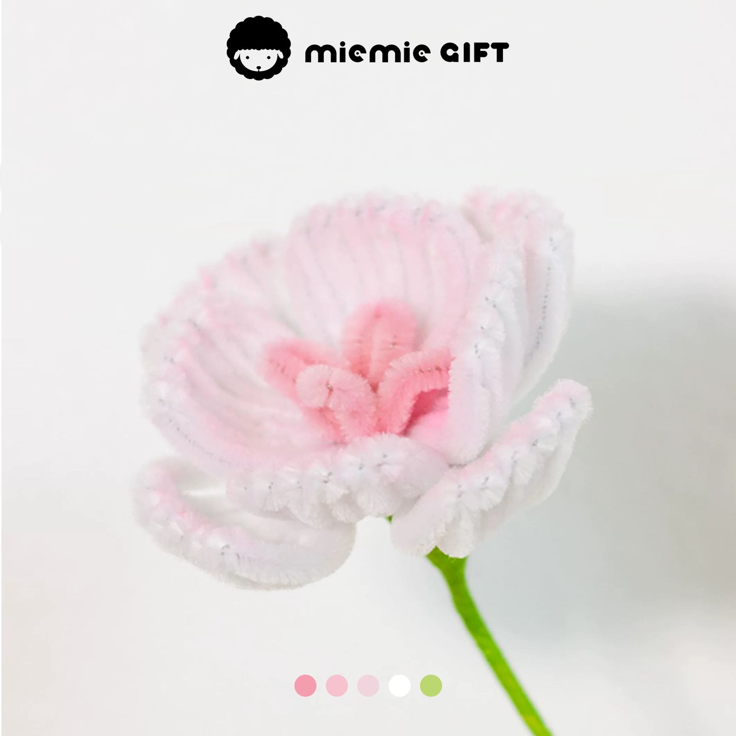 Close-up of a handmade pink and white ranunculus flower crafted with pipe cleaners by MieMie Gift, perfect for creative DIY flower arrangements.