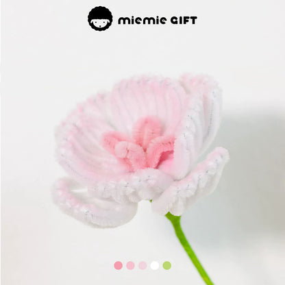 Close-up of a handmade pink and white ranunculus flower crafted with pipe cleaners by MieMie Gift, perfect for creative DIY flower arrangements.