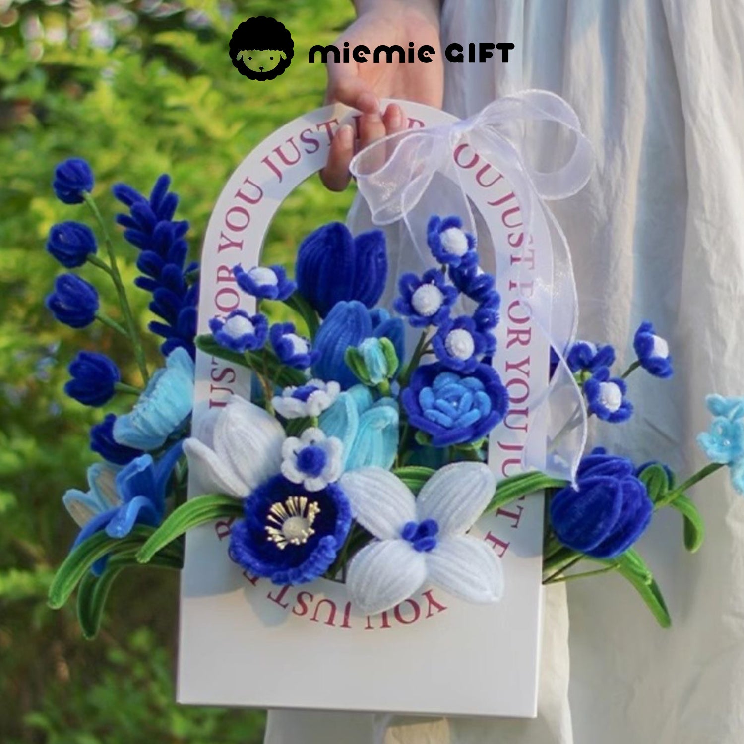 Ocean Breeze Basket by MieMie Gift with refreshing blue and white DIY pipe cleaner flowers, reminiscent of a calm and breezy ocean.
