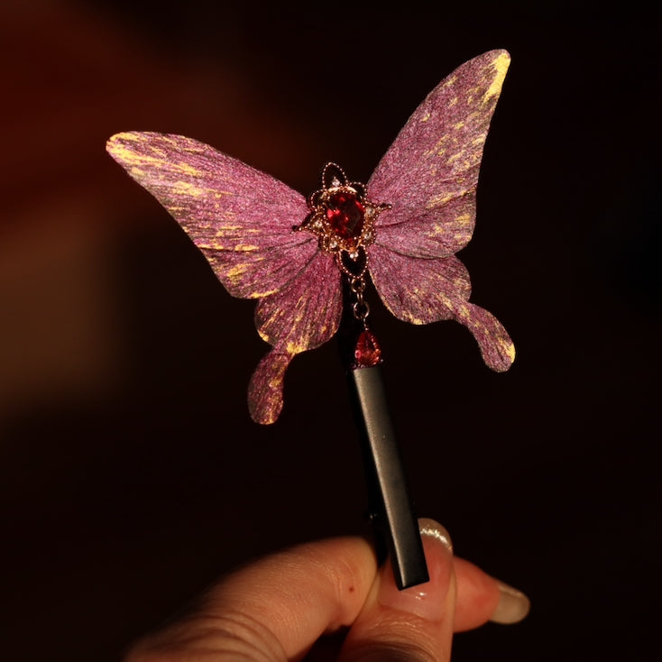 Handcrafted royal purple velvet butterfly hair clip by Chujiu Mountain Atelier, featuring golden accents, a red heart-shaped crystal, and a sleek design, perfect for elegant and versatile styling.