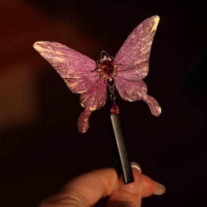 Handcrafted royal purple velvet butterfly hair clip by Chujiu Mountain Atelier, featuring golden accents, a red heart-shaped crystal, and a sleek design, perfect for elegant and versatile styling.