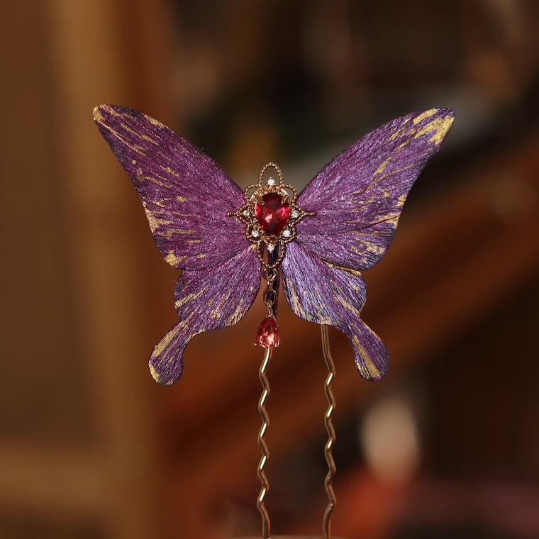 Handcrafted royal purple velvet butterfly hairpin by Chujiu Mountain Atelier, adorned with golden accents, a vibrant red heart-shaped crystal, and exquisite detailing, perfect for adding elegance to any hairstyle.