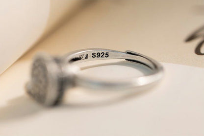 Close-up view of the S925 sterling silver marking on a rotatable ring, ensuring quality and durability with an elegant design.