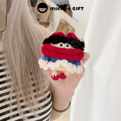 Close-up of Snow White knit earphone case with AirPods inside. The case is made of soft yarn in red, blue, yellow, and white, with a playful face and curly black hair, adding charm to your AirPods protection.