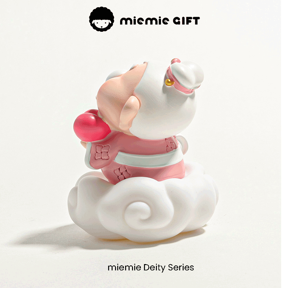 Chinese Matchmaker Deity Miniature: A cute Yue Lao figurine, the patron of love, adorned with a pink outfit and a golden hairpin, standing on a fluffy white cloud base